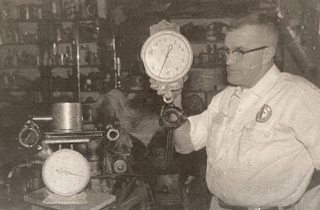 Mechanic weighing a piston