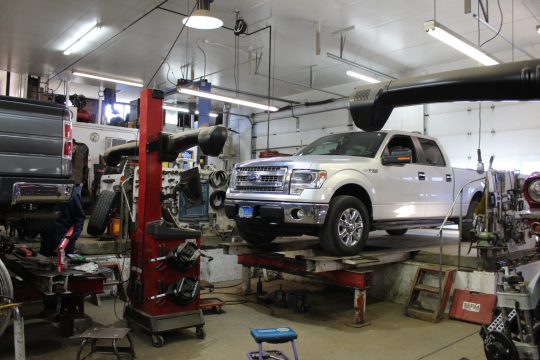 Truck on alignment rack Ford Truck on an alignment rack being repaired by Royal Wheel Alignment in Rapid City
