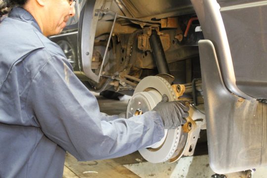 mechanic performing a brake inspection ASE Certified mechanic performing a brake inspection at Royal Wheel Alignment in Rapid City