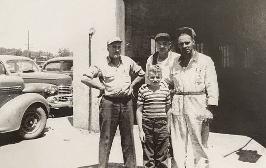 Mechanics standing in front of Royal Wheel Alignment